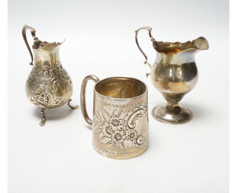 A Victorian silver inverted pyriform cream jug, London, 1886, 10.4cm, another, embossed, Chester, 1896 and an Edwardian silve