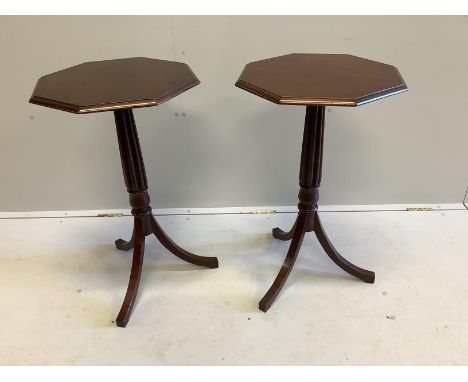 A pair of Regency style octagonal mahogany tripod wine tables, width 43cm, height 73cm