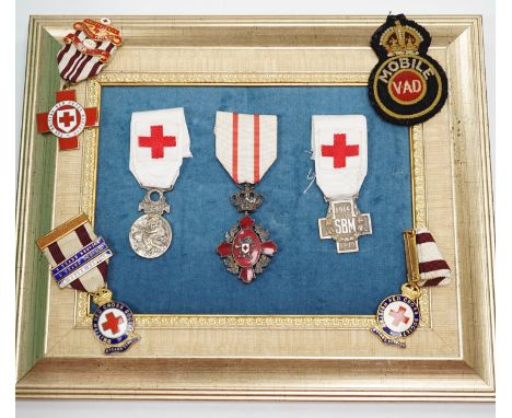 A collection of British Red Cross, medals, badges and memorabilia including a brass plaque, commemorating an auxiliary hospit