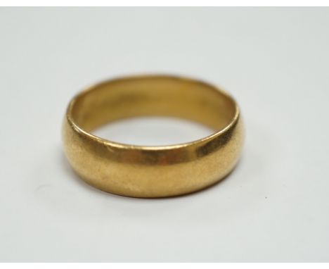 A 1960's 22ct gold wedding band, size M, 6 grams.