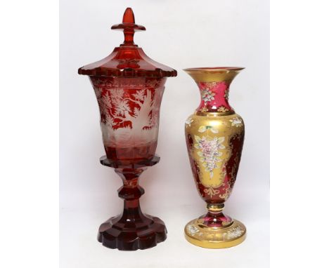 A late 19th century Bohemian ruby flashed and wheel engraved glass vase and cover, 52cm high and a Venetian enamelled glass v