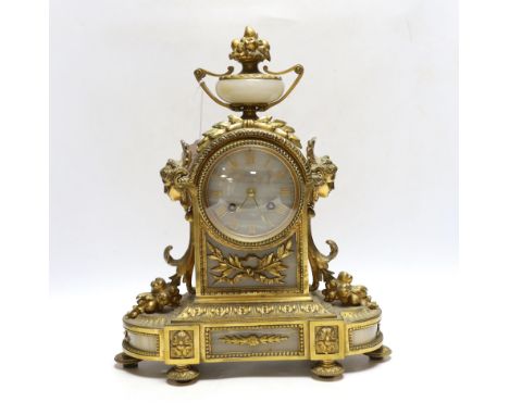 A late 19th century French gilt metal and onyx mantel clock, 34cm