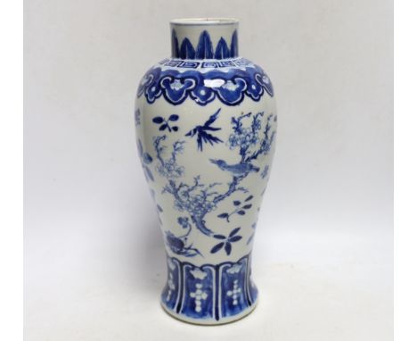 A Chinese blue and white baluster 'blackbirds amid blossom' vase, Kangxi mark, but late 19th century, 27cm