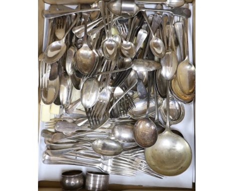 Three silver napkin rings, three silver spoons and a quantity of silver plated cutlery.