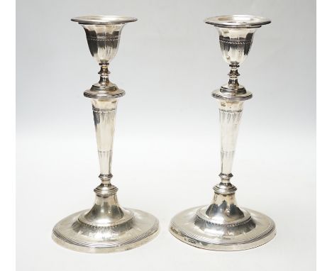 A pair of Edwardian silver mounted oval candlesticks, Thomas Bradbury &amp; Sons, Sheffield, 1901, 23.4cm, weighted.
