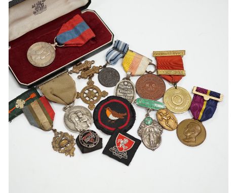 A collection of medals and badges, including eight Special Constabulary Service Medals, Fire Service Medal, a cased Police Lo