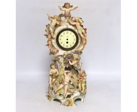 A Continental porcelain figural mantel clock, no movement