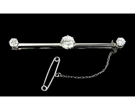 Diamond set bar brooch, three round brilliant cut diamonds, estimated total diamond weight 1.38 carats, mounted in tested wit