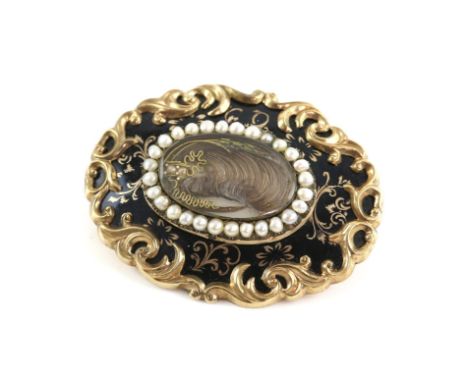 Victorian mourning brooch, with black enamel and seed pearls, displaying a lock of hair, dated on the back 1854, in gold, wit
