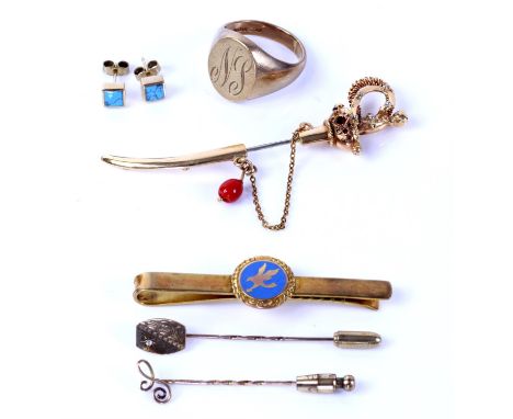 Three stick pins, including one in the design of a sword, set with red stones and a banded agate drop, in tested 18 ct gold, 