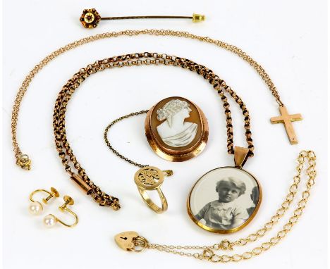 Collection of gold items, including a stick pin set with a round cut ruby, in stamped 15 ct gold, a curb link bracelet with a