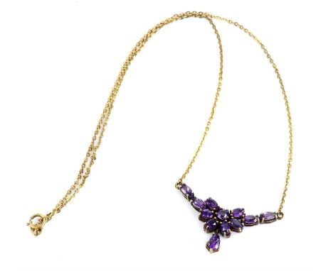 Amethyst necklace, set with oval and round cut amethysts on an integral chain, in 9 ct yellow goldCondition Report:  Gross we