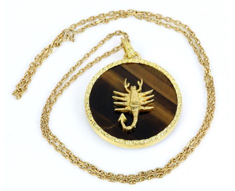 Tigers eye pendant, large circular tigers eye pendant with a motif of a scorpion to the centre and a gold border, on a fancy 