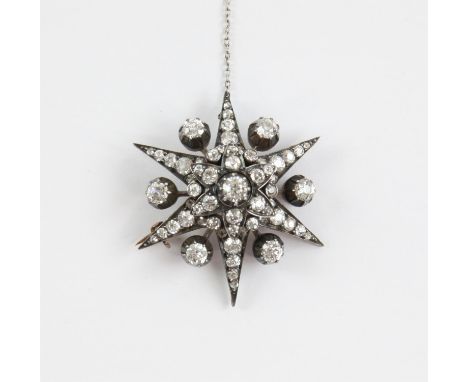 Victorian diamond star brooch, set with graduated old cut diamonds and rose cut diamonds, mounted in silver with a gold backi