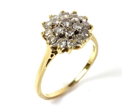 Diamond cluster ring, round brilliant cut diamonds mounted in stamped 18 ct yellow gold, ring size OCondition Report:  Gross 