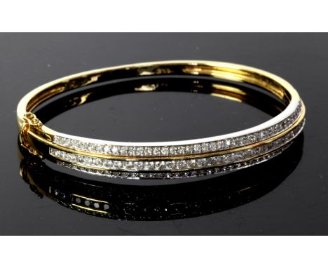 Diamond set hinged bangle, three rows of diamonds with round brilliant cut diamonds set to the centre and old cut diamonds ei