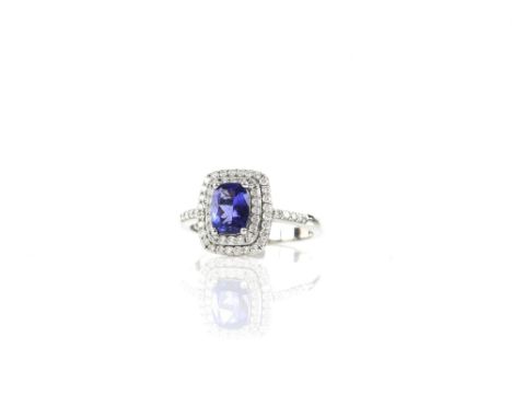 Tanzanite and diamond ring, with central rectangular cut tanzanite, estimated weight 1.60 carats, with a double row halo of r