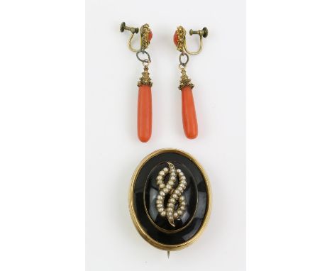 A gold mourning brooch, oval brooch with black enamel, with a seed pearl set knot at the centre, with a locket compartment at