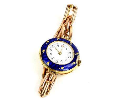 A ladies gold and enamel watch, the blue enamel bezel surmounting an unsigned white enamel dial with Arabic numeral hour mark