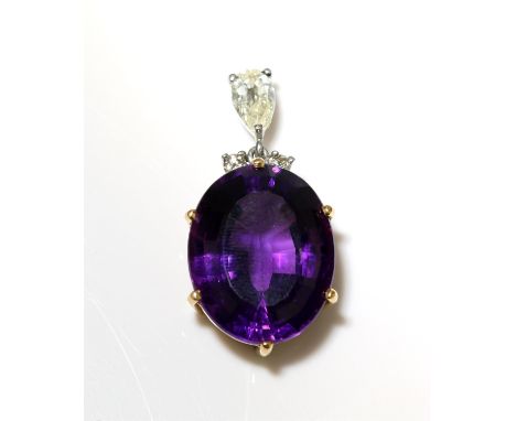 Amethyst and diamond pendant, pear shaped diamond weighing an estimated 0.50 carat, with two round brilliant cut diamonds set