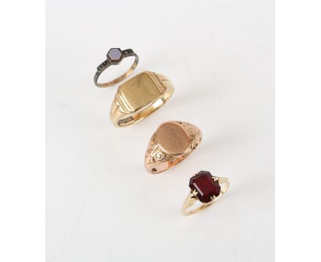 Two signet rings, one in yellow and one in rose 9 ct gold, sizes T and W, a red stone set ring in stamped 9 ct yellow gold, s