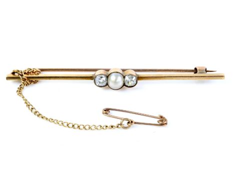 Pearl and diamond bar brooch, central pearl millegrain set with an old cut diamond set either side, with safety chain, mounte