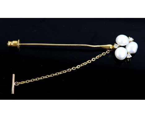 Pearl and diamond stick pin, set with three button pearls and three round brilliant cut diamonds, mounted in stamped 18 ct ye