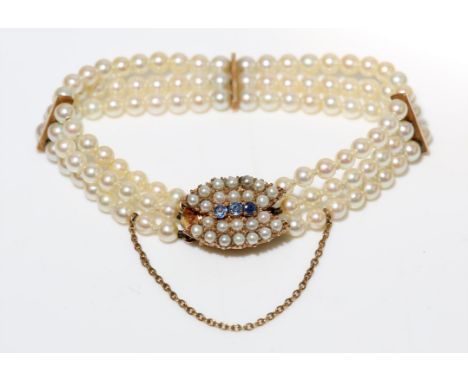 Pearl bracelet, three strands of 4mm pearls, with three gold bar spacers, clasp set with seed pearls and three round cut sapp