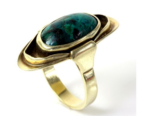 Chrysocolla dress ring, oval cabochon cut chrysocolla, rubover set in an elongated oval mount, in 14 ct yellow gold, ring siz