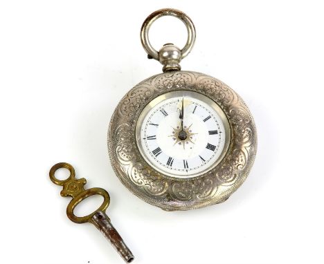 A ladies silver pocket watch with foliate embossed case, the unsigned white enamel dial with Roman numeral hour markers, fitt