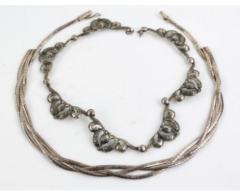 Two silver necklaces, including a three row, plaited flat snake chain necklace, with a box clasp, together with the central s