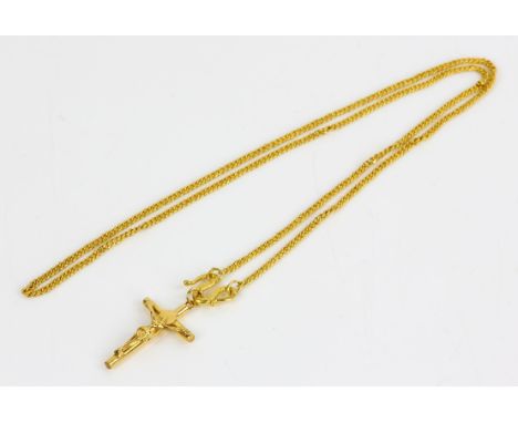 Crucifix pendant on a flat curb link chain, in stamped 14 ct, chain length 48cmCondition Report:  Gross weight 10.4 gramsOver
