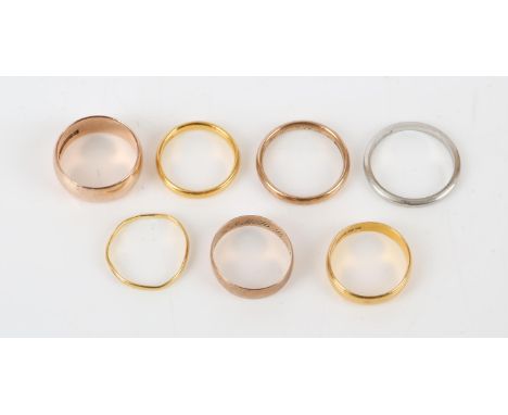 Collection of gold wedding bands, two in 22 ct yellow gold, both rings size L, three in 9 ct rose gold, ring sizes L, N and P