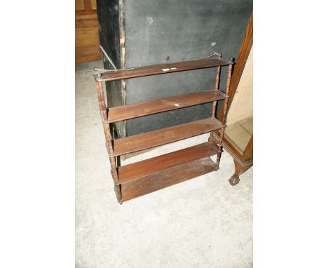 A Mahogany Four Shelf Wall Rack