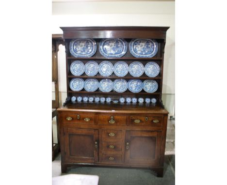 An Antique Oak North Wales Dresser Having A Three Shelf Rack The Base Having Two Side Cupboards Each With Drawer Above And A 