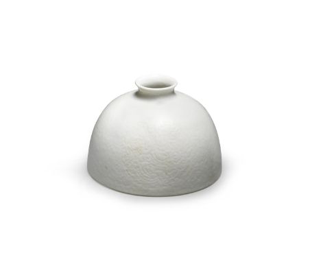 A SOFT-PASTE WHITE-GLAZED BEEHIVE-SHAPED WATERPOT, TAIBO ZUN KangxiThe domed vessel with orange-peel skin surmounted by a sma