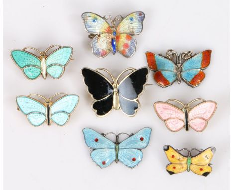 Eight silver and polychrome enamel decorated butterfly brooches, to include three Norwegian examples, the largest 25.5mm wide