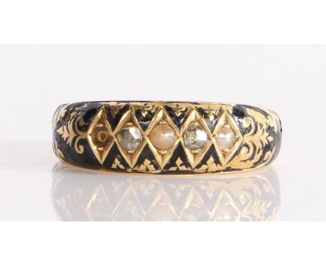 An elegant Victorian mourning ring having alternating seed pearls and diamonds, circa 1894-95,set in an 18 carat carved gold 