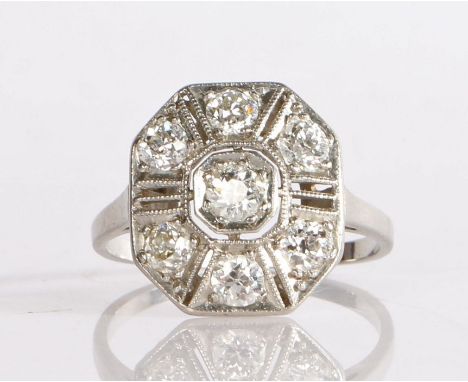 A beautiful Art Deco platinum and diamond plaque ring of geometric design, having an old cut diamond to the centre, surrounde