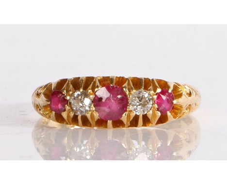 A 19th Century 18 carat gold diamond and ruby set ring, with three rubies and two diamonds to the head, 3.8 grams, ring size 