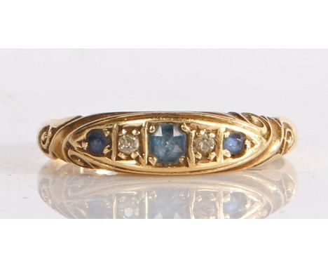 18 carat gold and gem-set ring, having sapphires and diamonds in a carved mount, 2.44 grams, ring size K