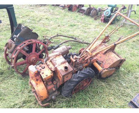 A vintage multipurpose small tractor unidentifiable British maker open red steel wheels and a vintage Tiller single cylinder 
