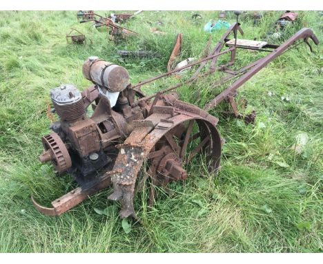 A large Vintage Trusty Tractor The Iron horse with double steel rimed wheels single cylinder four stroke plate numbered 261. 