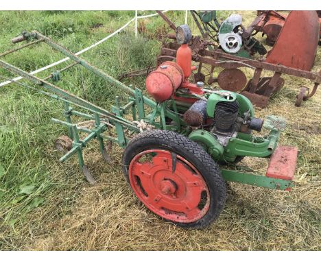A Vintage Small holders Tractor with a single cylinder engine The Auto Culto chain driven with a four farrow drill attachment