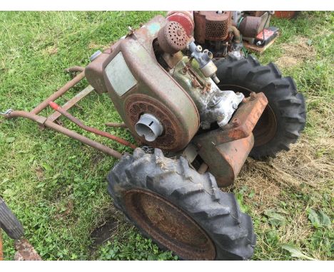 A Vintage Mayfield garden tractor universal with single cylinder chain driven.