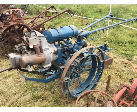 A rare vintage British made 8HP tractor with double steel wheels and single farrow plough attachment hand crank start maker B