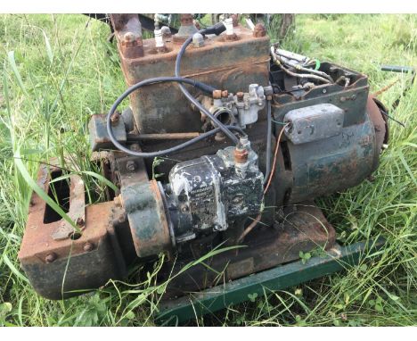 A Vintage generator with a two cylinder engine