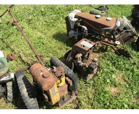 A Vintage cultivator a static engine and a small garden tractor with attached implement.