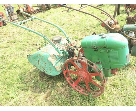 A Vintage Simar Rototiller finished in green and red with open steel wheels type 5D single cylinder engine. maker Geo Monro L