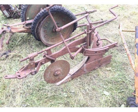 A Vintage single farrow plough small, tractor implement. A British Anzani PS plough